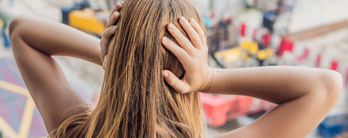 Lady holding ears